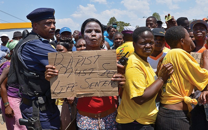 A protester holds on October 18, 2013 a placard reading 