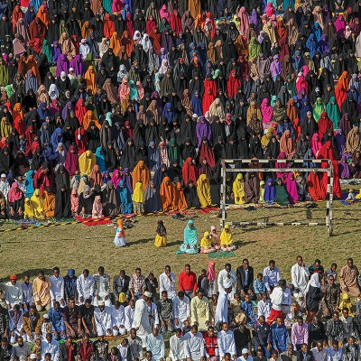 Muslim faithful take part in morning prayers to celebrate the first day of the Muslim holiday of Eid-al-Fitr in Kenya's capital Nairobi