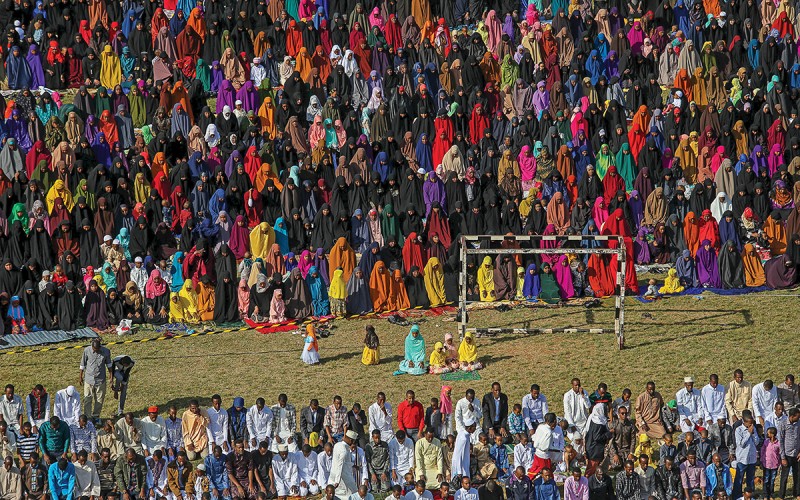 Muslim faithful take part in morning prayers to celebrate the first day of the Muslim holiday of Eid-al-Fitr in Kenya's capital Nairobi