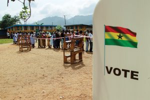 People Wait To Vote At A Polling Station In Kibi, Eastern Region Of Ghana
